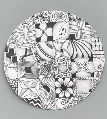 a black and white drawing of a circular object