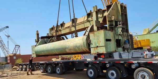 machinery under crane onto trailer