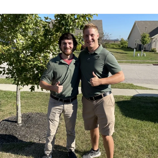 Two Lux Lawn Care employees in Brownsburg, IN.