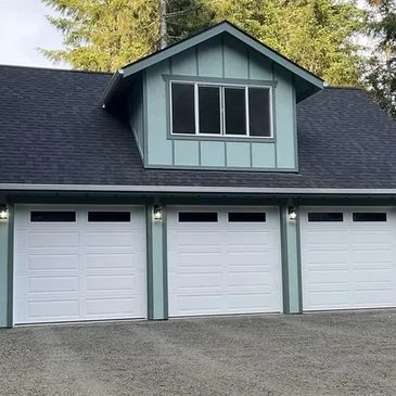 Custom garages for storage, workspace, and added value.