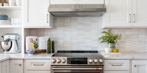 Marble tile backsplash white kitchen renovation