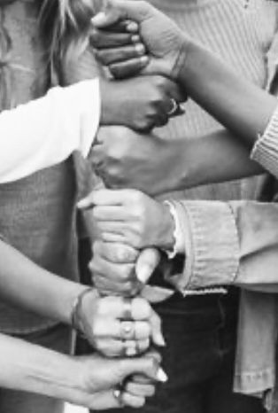 Hands joined together in a vertical chain symbolizing unity.