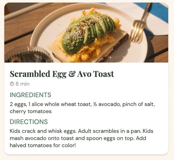 Scrambled egg and avocado toast with sesame seeds on a white plate.