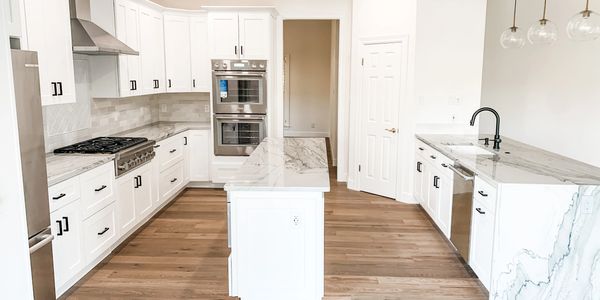 Kitchen remodel in Westlake hills, Tx with white cabinets done by Pro Tech Construction Inc 