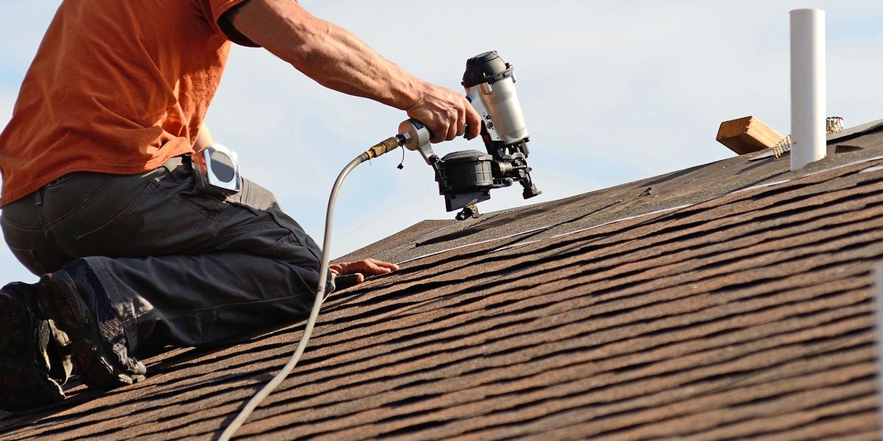 man fixing the roof