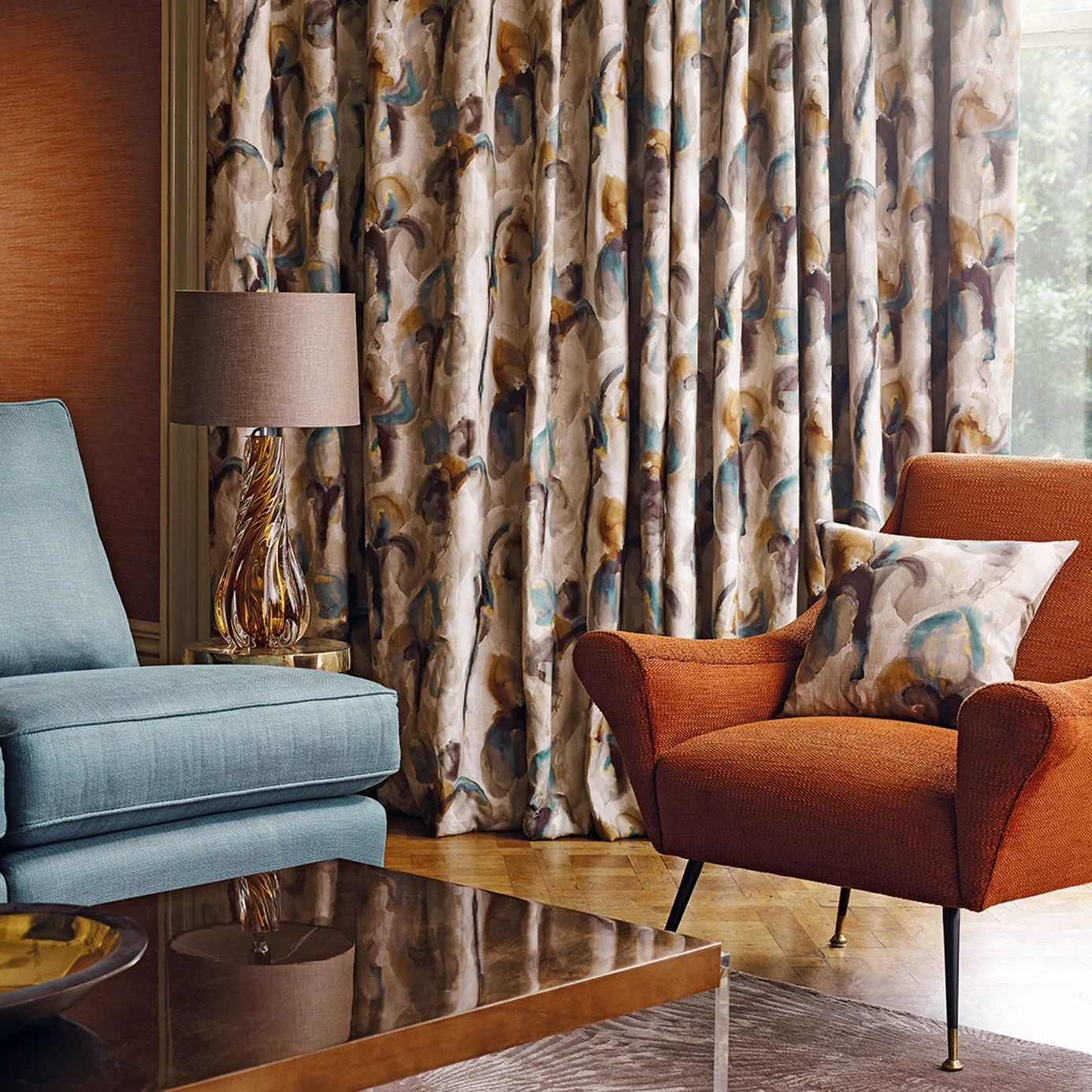 blue chair left, orange chair right with Zoffany fabric cushion and matching curtains