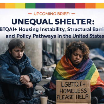 Two individuals experiencing homelessness, one holding a sign seeking help for LGBTQI+ homeless.