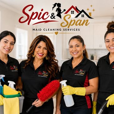 Four smiling women in cleaning uniforms holding cleaning supplies.