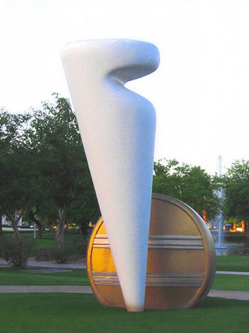 Tall white form near mountains.