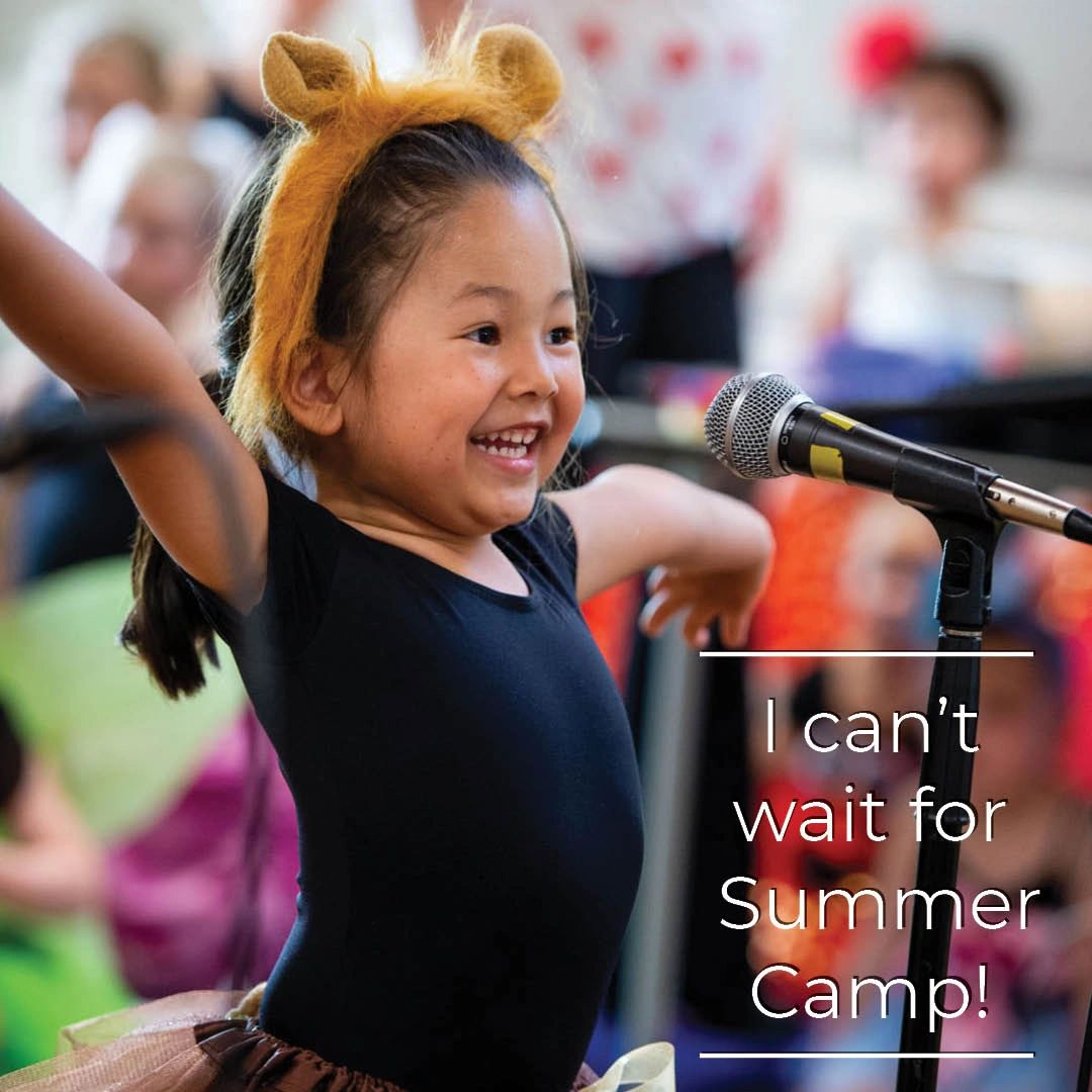 Student Posing In Front of a Microphone