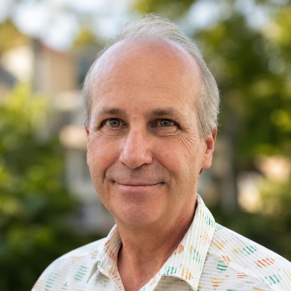 Smiling middle-aged man outdoors.