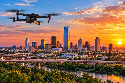Aerial drone flight near Oklahoma City, with the city skyline visible in the background.