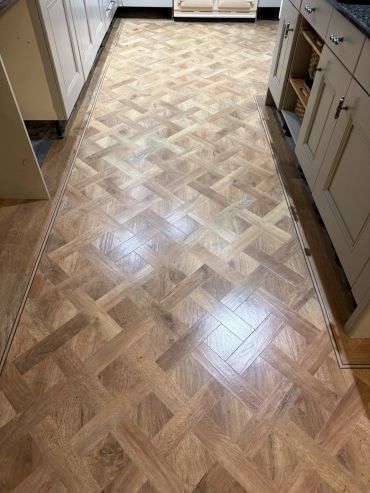 Wood patterned floor tiles in a kitchen.