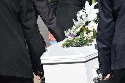 Men carrying coffin