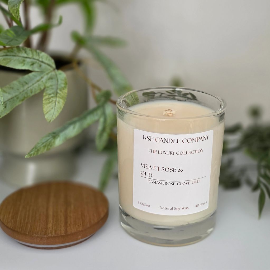 A 30cl soy wax candle in clear ebony jar in scent Velvet Rose and Oud from our luxury candle range