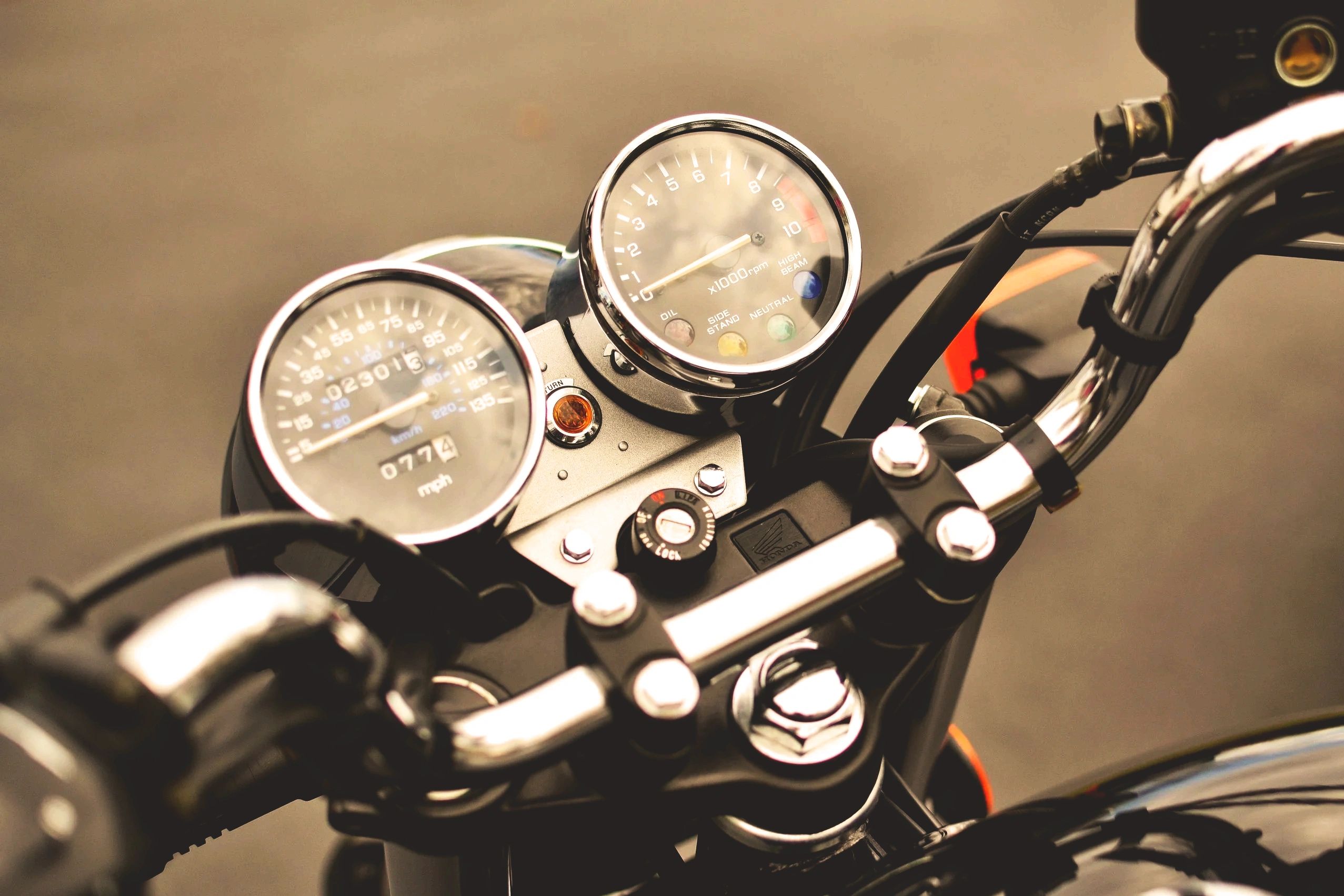 Close-up of a motorcycle's speedometer and tachometer.