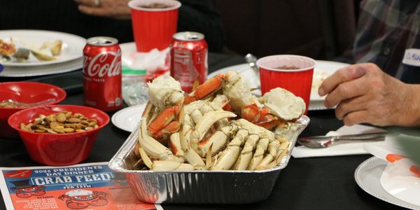 Large-scale crab feed meal service for community and corporate event