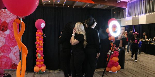 360 photo booth setup with lighting and branded backdrop by A&A Event Production