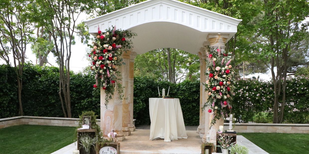 Wedding ceremony setup with custom staging and floral design by A&A Event Production at Napa Valley