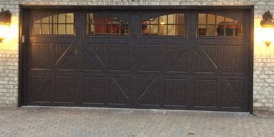 Amarr classica carriage house garage door with windows.  Brown garage door.