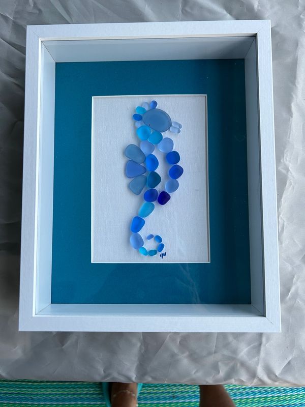 Seaglass Seahorse.  She is made from real seaglass is used. This keepsake is framed in white. 9x11