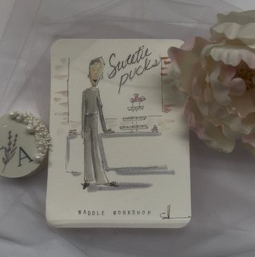 Artistic sketch of a person with 'Sweetie puck' text and a flower beside it.