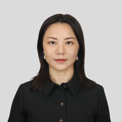 Professional portrait of a woman in black attire.