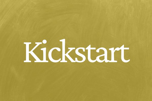 White text saying 'Kickstart' on a textured yellow background.
