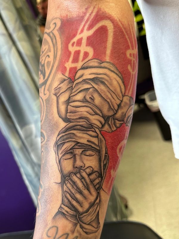 Black and gray see no evil, hear no evil, speak no evil tattoo with red background accents.