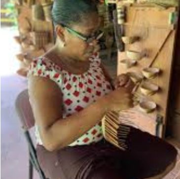 Woman crafting handmade items indoors.