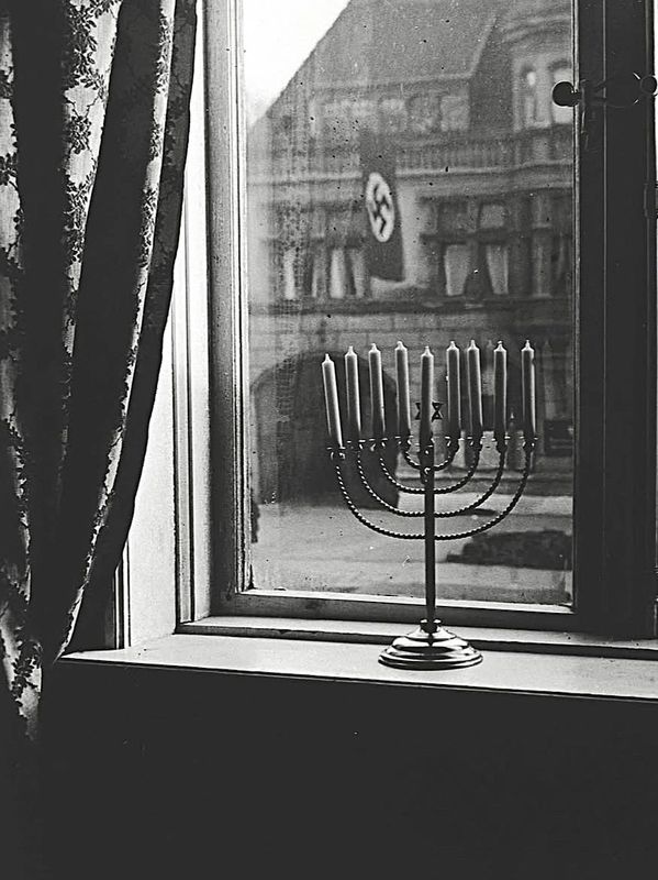 Photograph by Rachel Posner of her Chanukah menorah in the window
