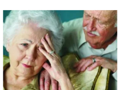 a man with hand on the shoulder of a lady 