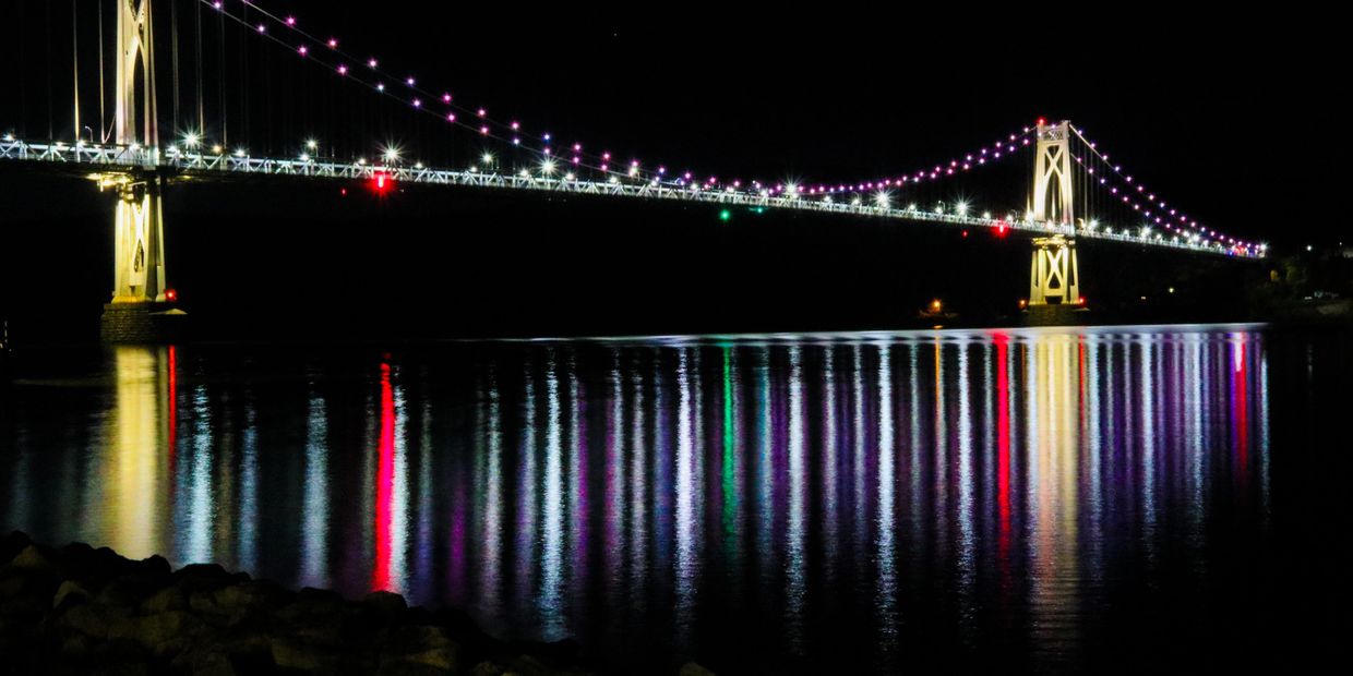 Mid-Hudson Bridge at night reflecting on the Hudson River NY