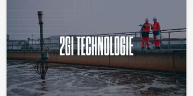 Two workers inspect a wastewater treatment facility with 2G Technologie branding.