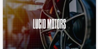 Close-up of a sleek car wheel with Lucid Motors logo.