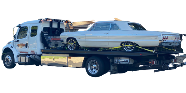 Cream 1964 Chevy Impala on flatbed Tow Truck from Dean Martin Towing + Recovery