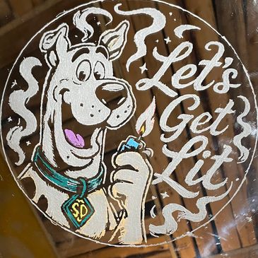 Scooby-Doo holding a lighter with the text 'Let's Get Lit'.