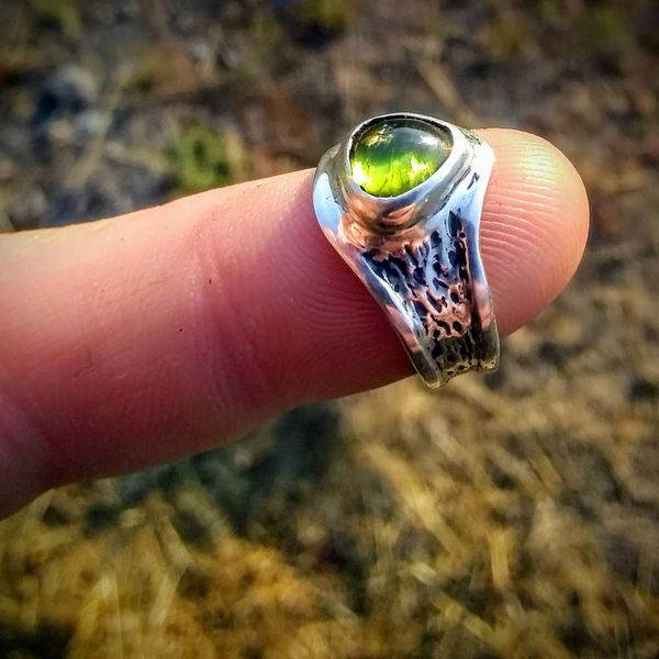 Image of a sterling silver ring with a peridot from The Sterling Cache. 