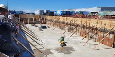 Construction site with workers and equipment.