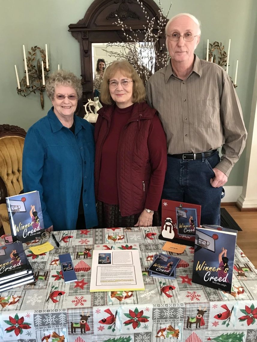 Here I am with my husband Danny and sister-in-law Christine at my book signing for Winner's Creed