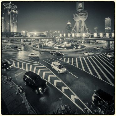 View on Lujiazui roundabout by the Pearl tower from the walking bridge around the square after the s