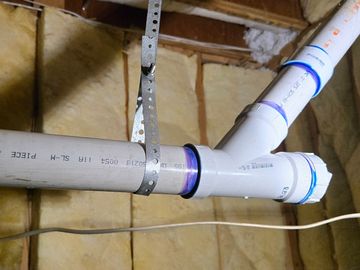 PVC pipe repair in a basement