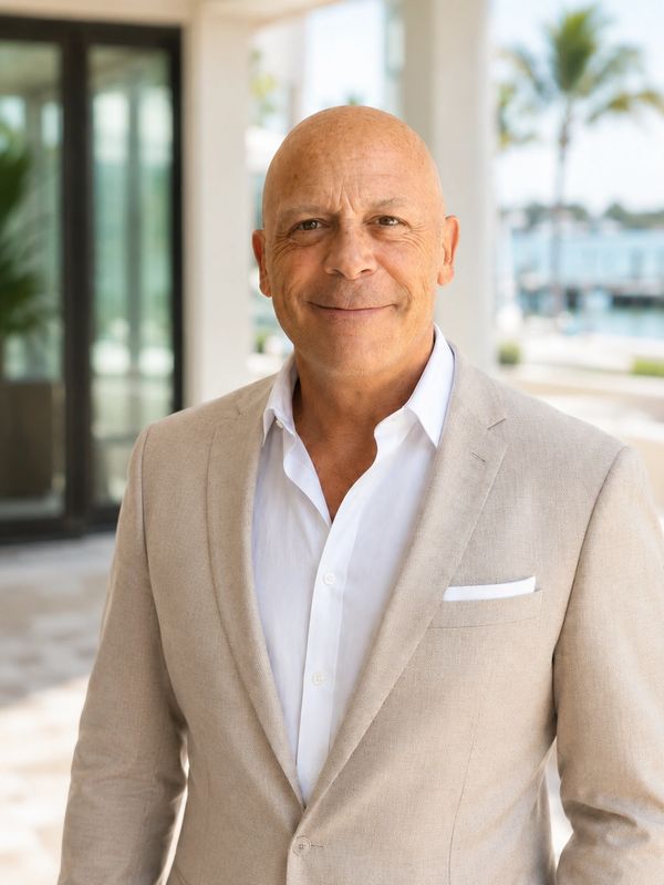 Confident man in beige suit outdoors.