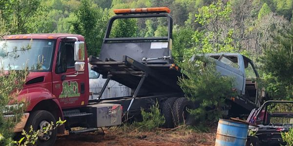 Rollback working on cleaning and loading cars