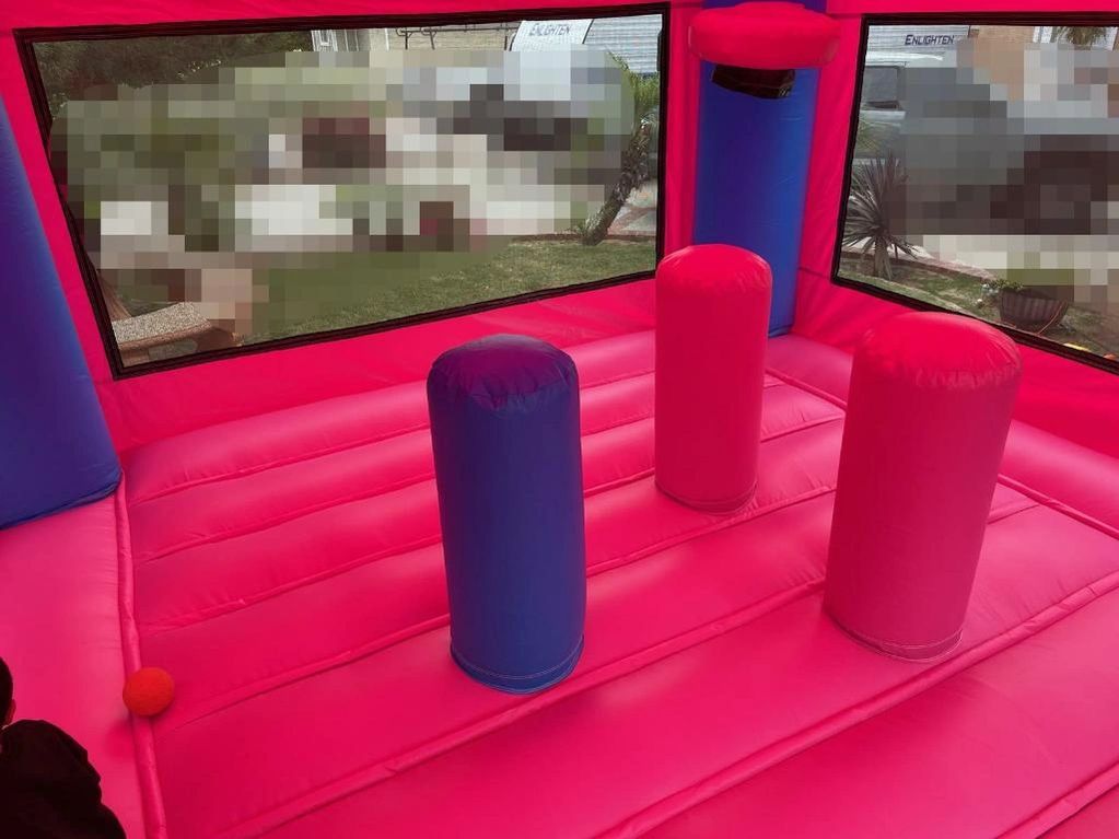 Inside of  jumpers. All bounce houses have a hoop and punching bag
