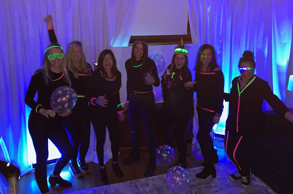 Group of ladies at a GLOW BAR neon party.