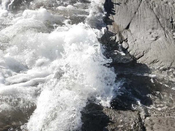 Crashing waves on rocks - Jane photography copyright. 
