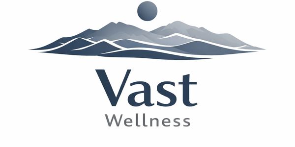 Logo with mountains and sun for Vast Wellness.