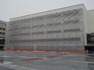 Poly enclosure on the facade of a twin cities building