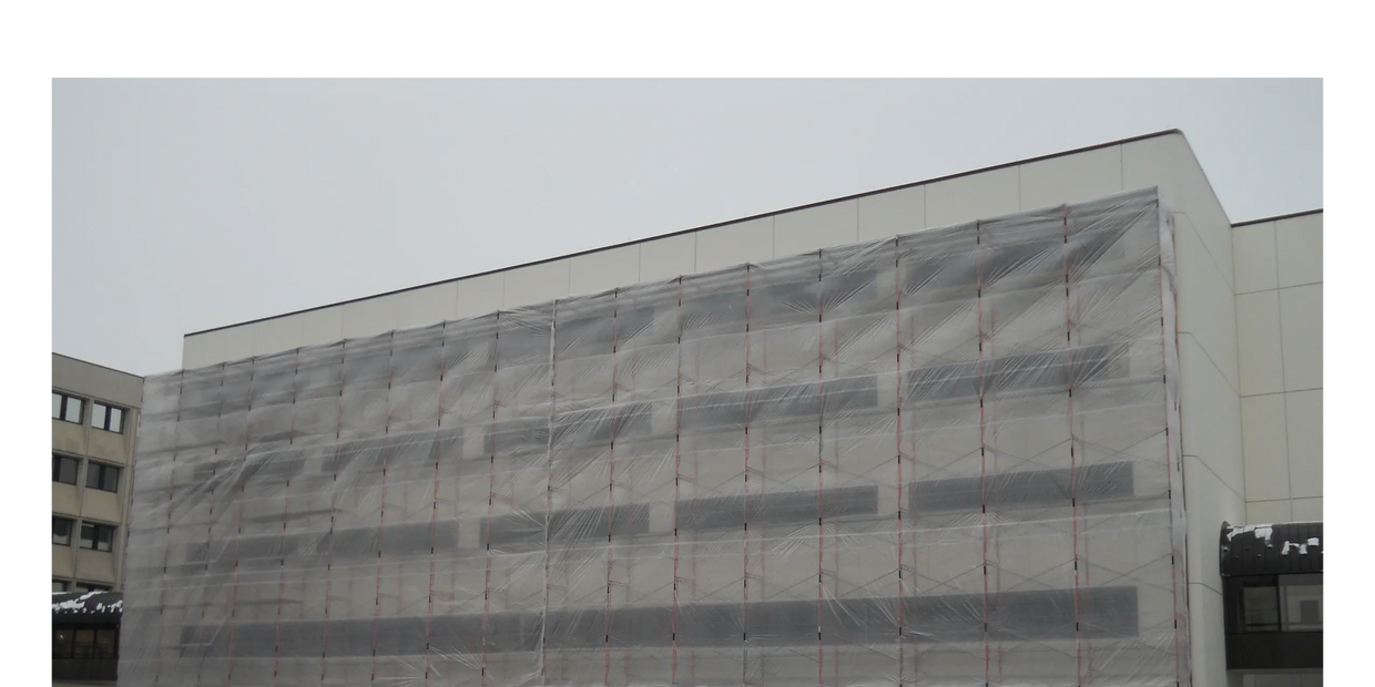 6 mil poly enclosure on the exterior of a building